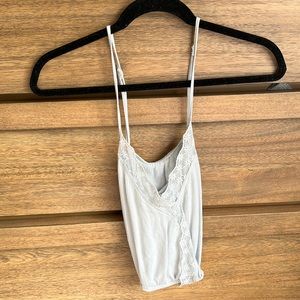 Light blue, spaghetti tank that crosses in the front